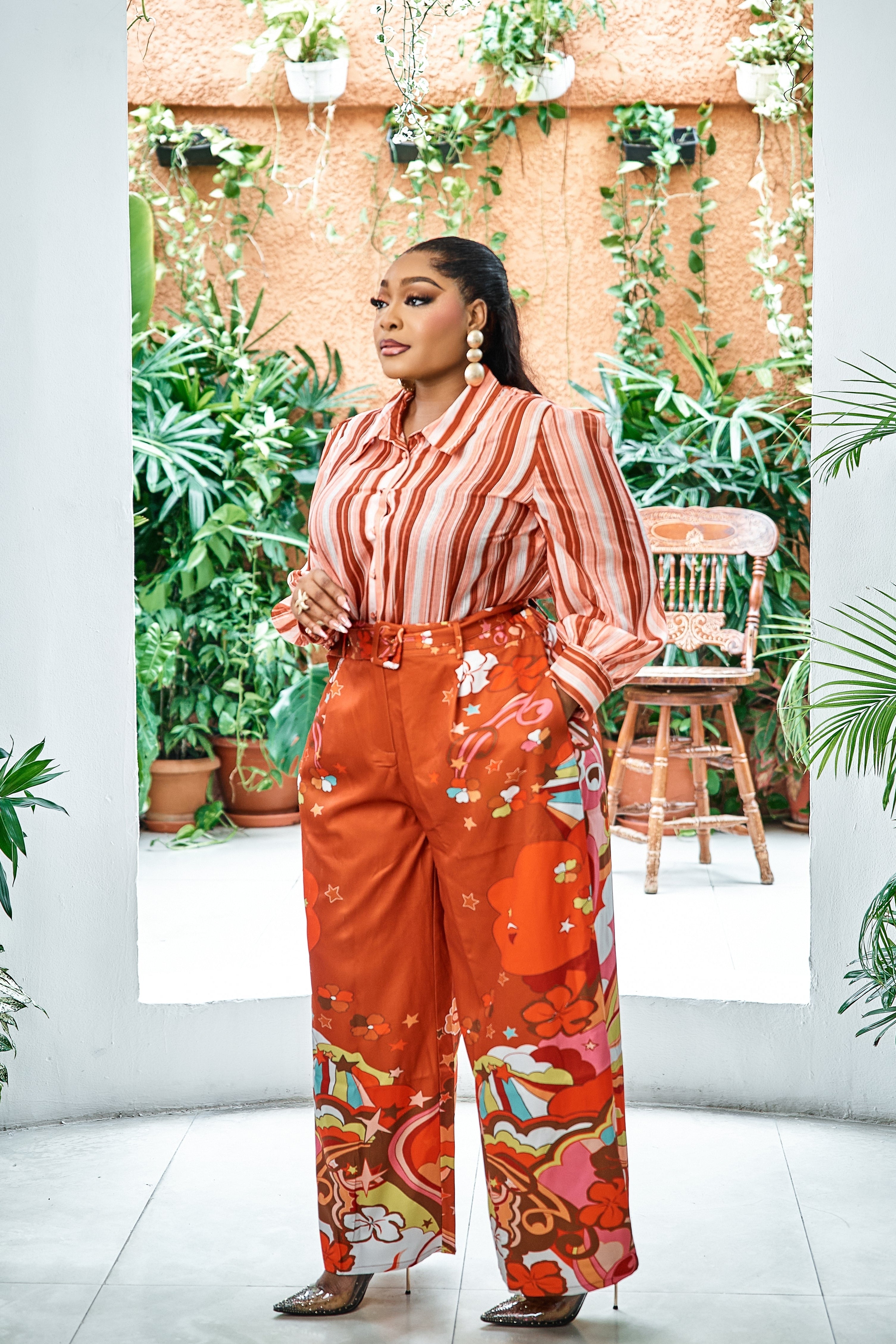Sterra Fashion Portofino Sunset Palazzo Set featuring flowy, colorful patterned pants and matching top on a model.