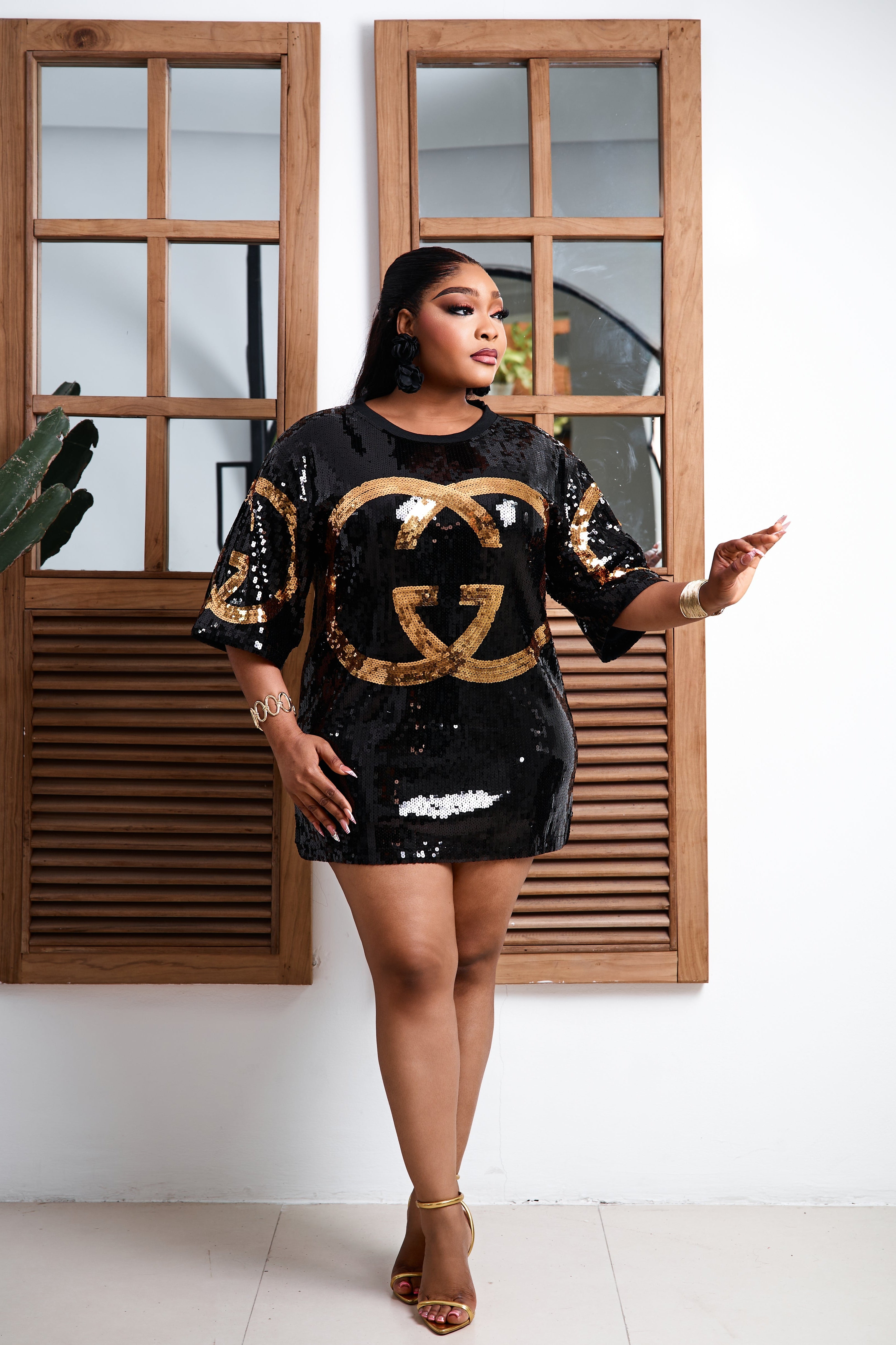 Black sequin tee dress from STERA FASHION BOUTIQUE featuring a relaxed fit and shimmering sequins for a stylish look.