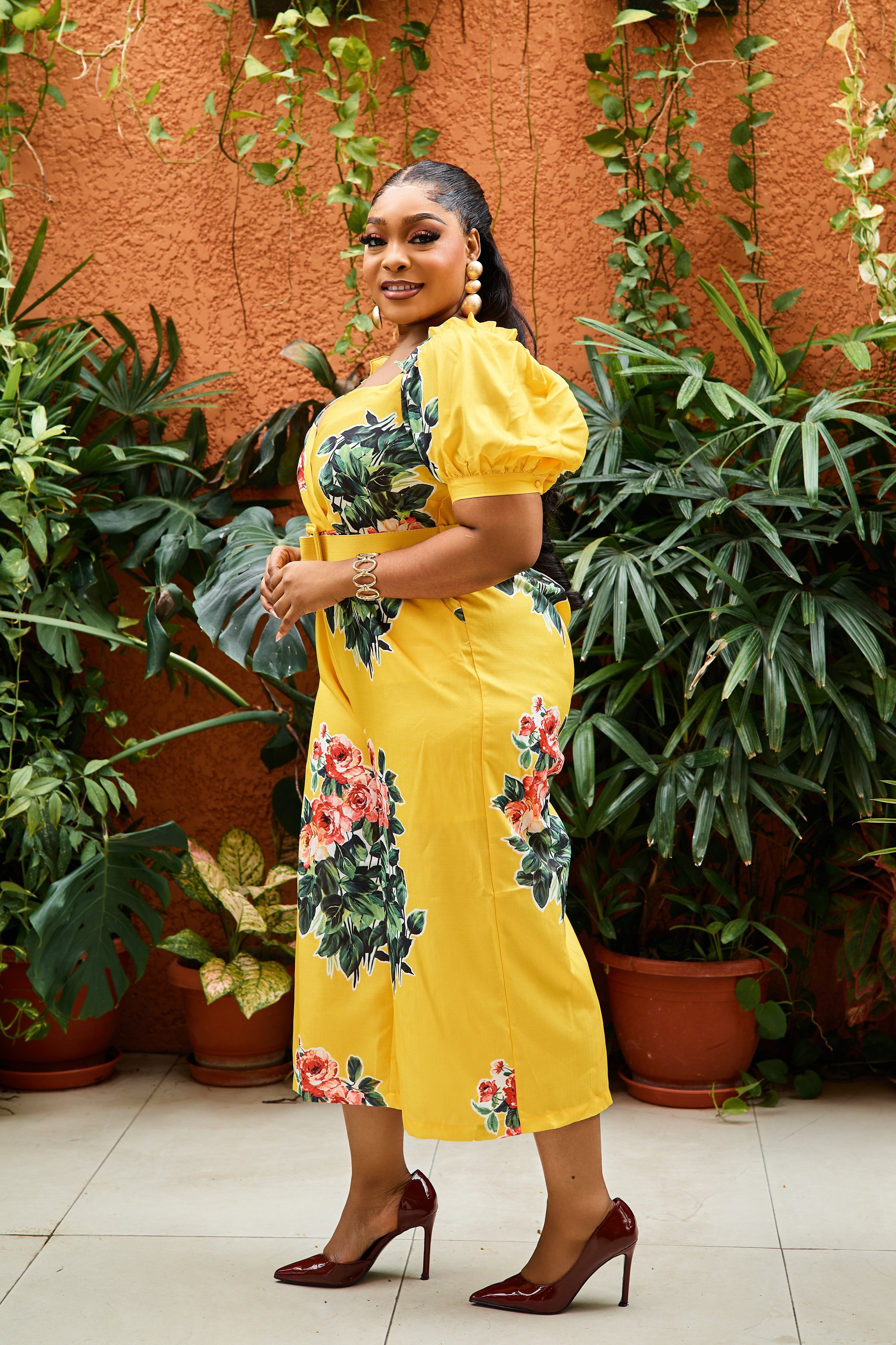 Sterra Fashion Belle Fleur jumpsuit displayed on a hanger, featuring a stylish floral pattern and elegant design.