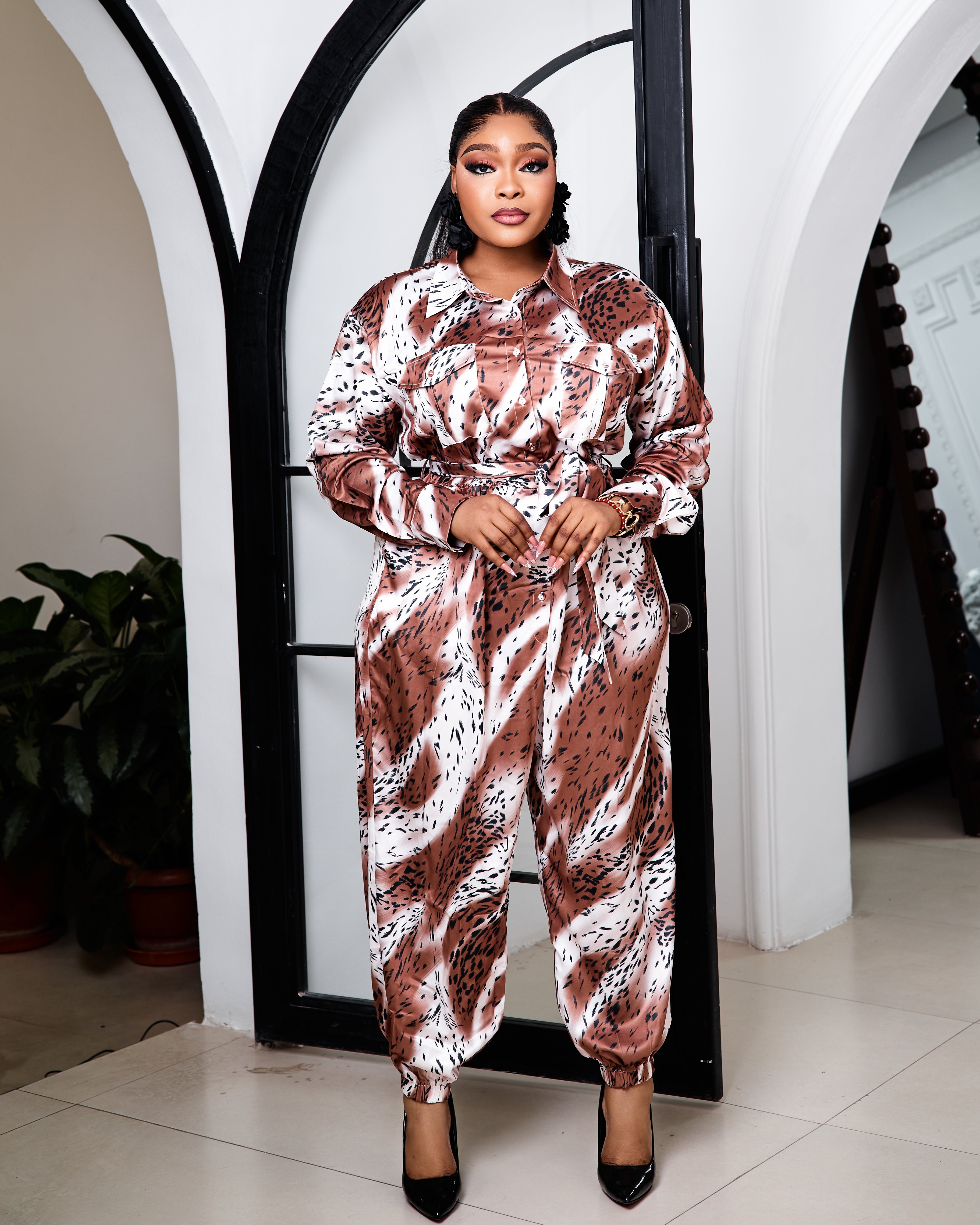 Glamour Capri jumpsuit by STERA FASHION BOUTIQUE, featuring a stylish fitted design with wide-leg pants and a sleeveless top.