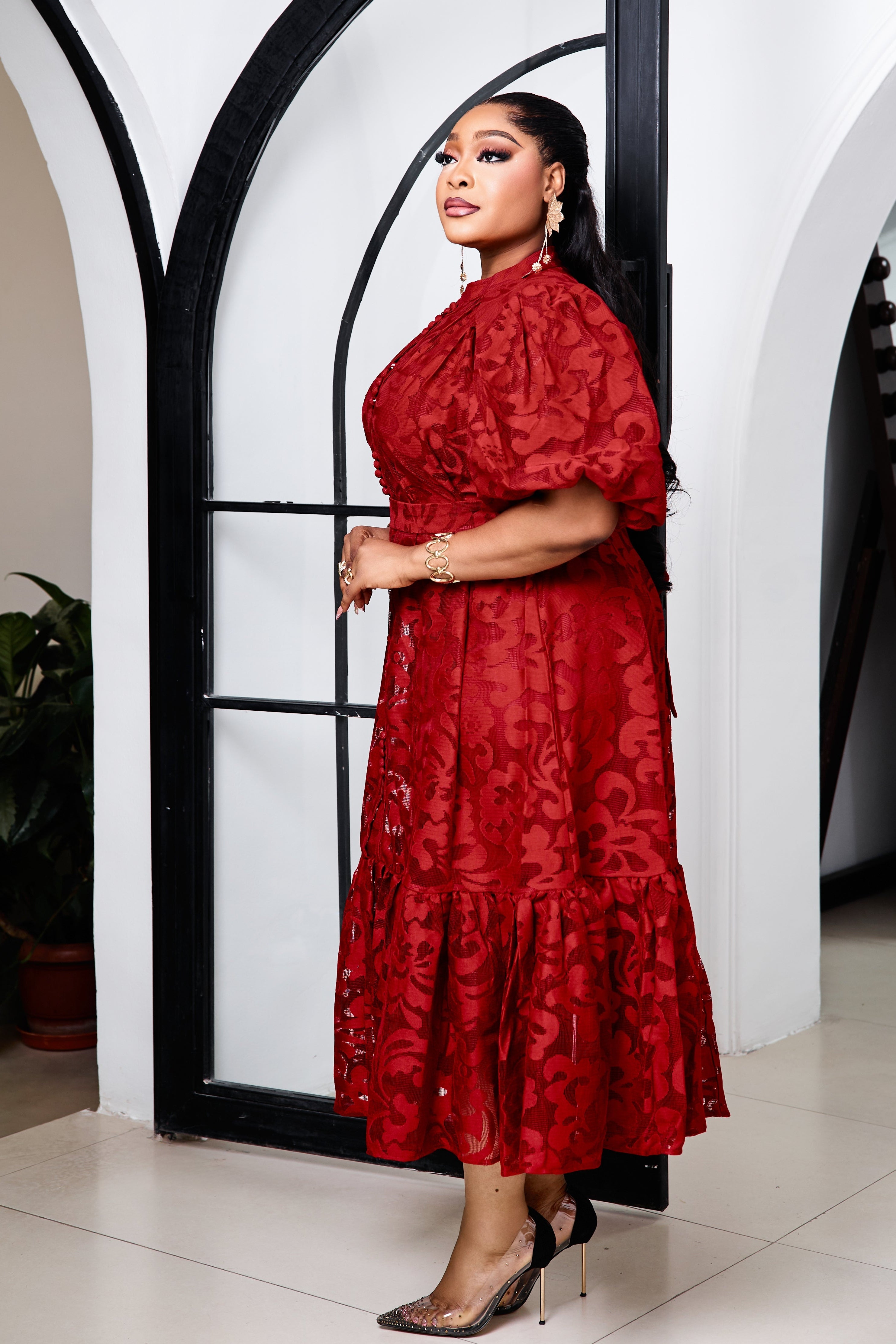 STERA FASHION Duchess Rouge Lace Dress displayed on a hanger, featuring intricate lace details and a vibrant red color.