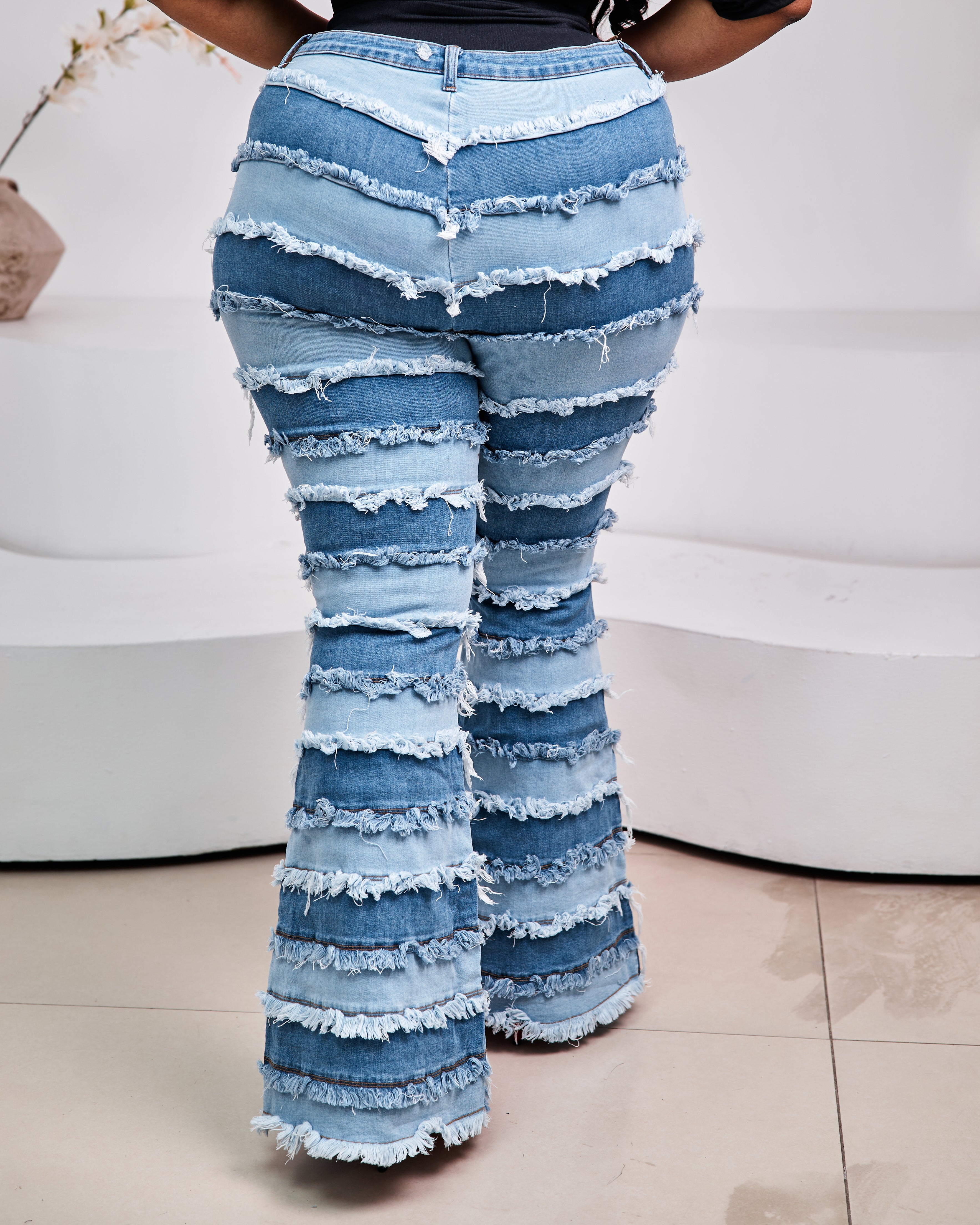 Sterra Fashion Milan Fringe Denim Jeans featuring distressed denim and fringe details, casual streetwear style.