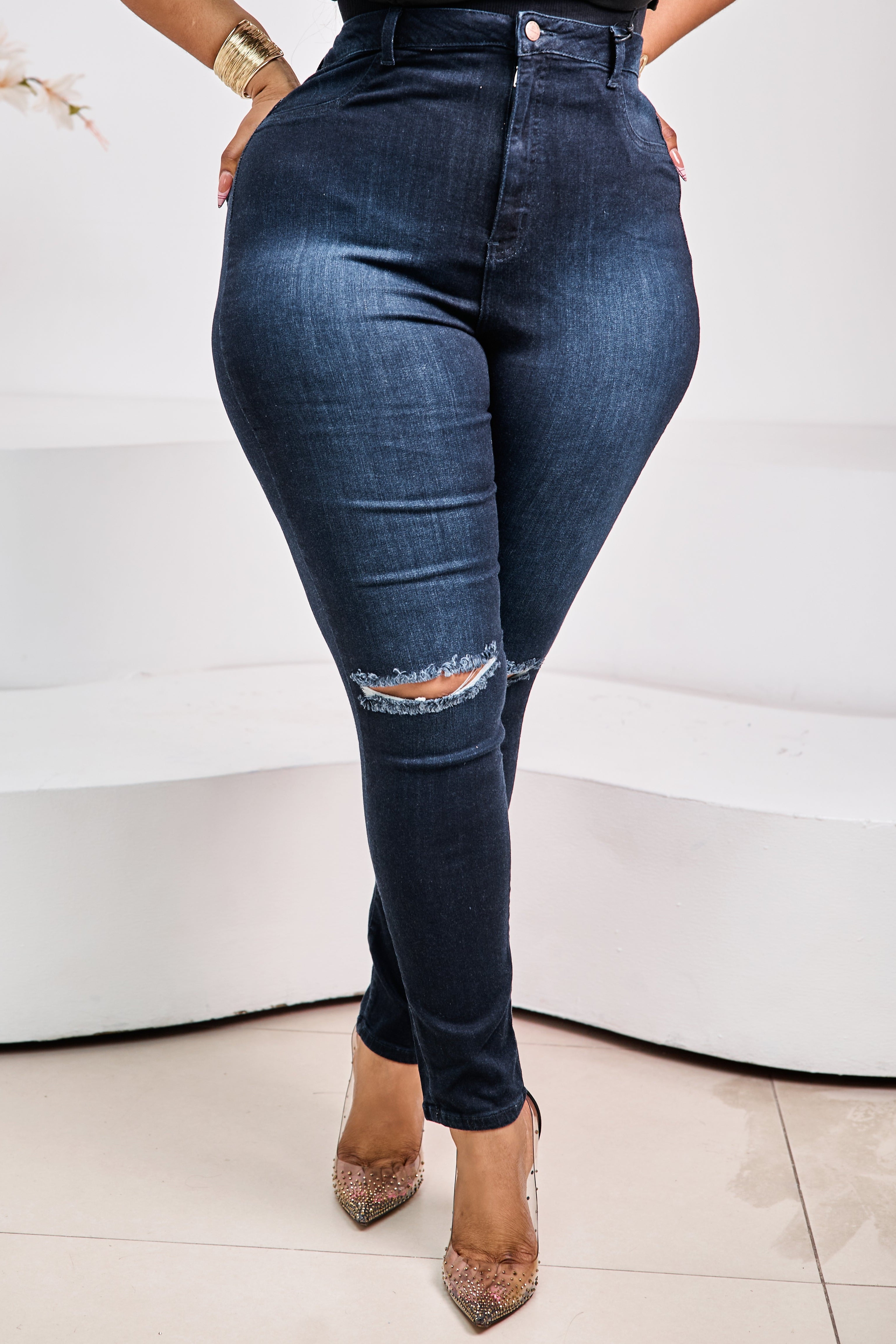 Sterra Fashion Γclipse Sculpt Denim jeans displayed on a hanger, showcasing their fitted design and dark wash fabric.