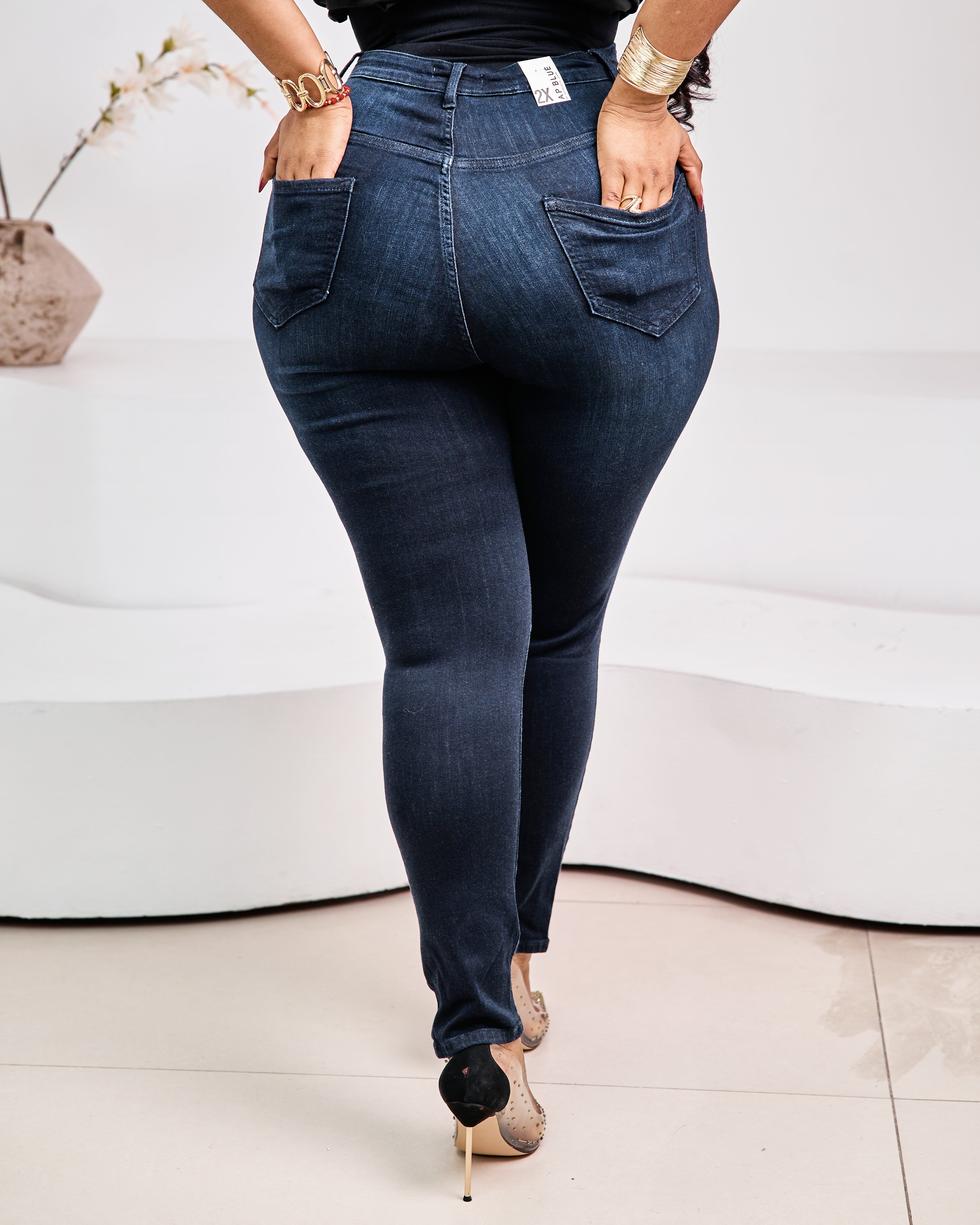 STERA FASHION Éclipse Sculpt Denim jeans shown on a model, featuring a fitted silhouette and classic blue denim fabric.