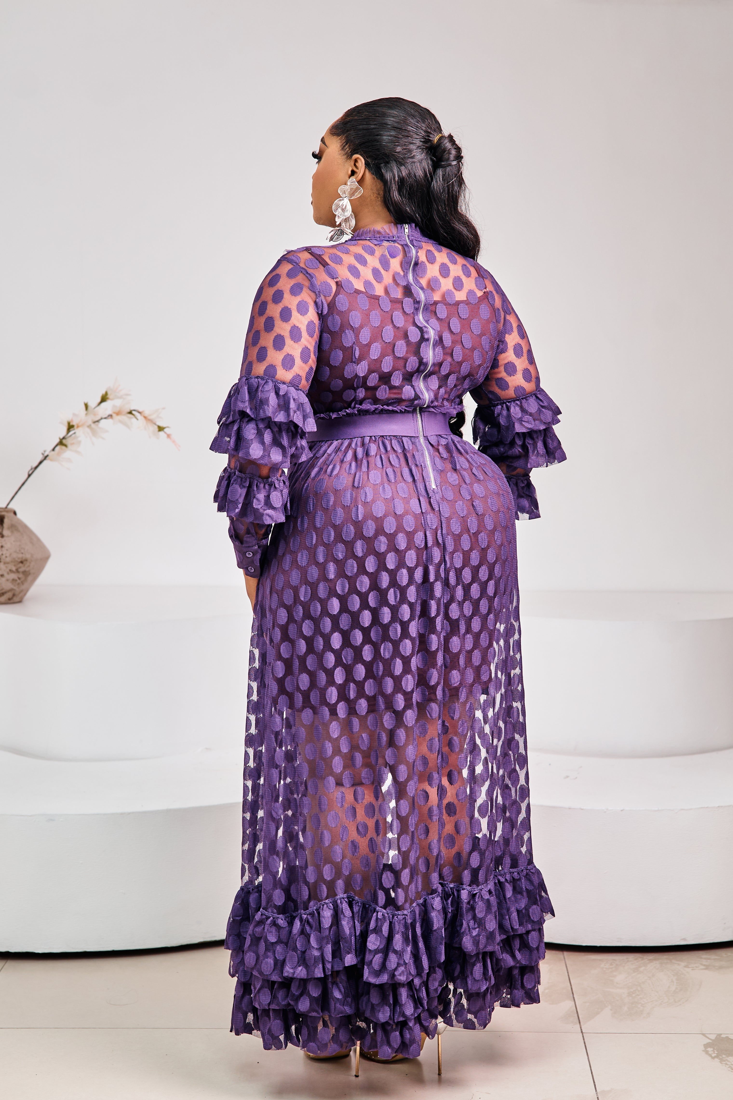 Sterra FASHION Tropez Elegance Dress displayed on a hanger, featuring a stylish, flowy design in a vibrant color.