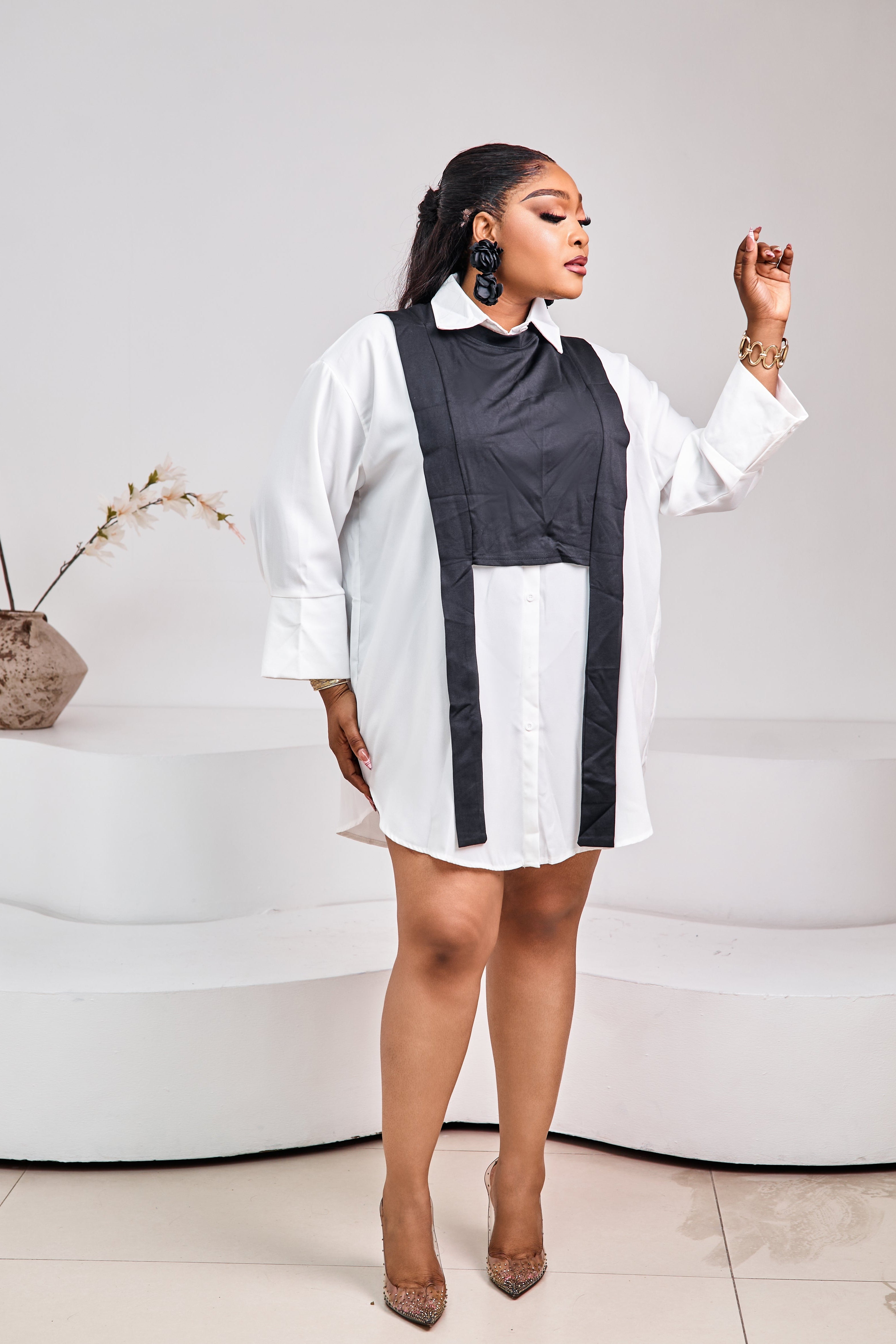 White Luxe Shirt Dress by STERA FASHION displayed on a hanger with button details and a classic collar.