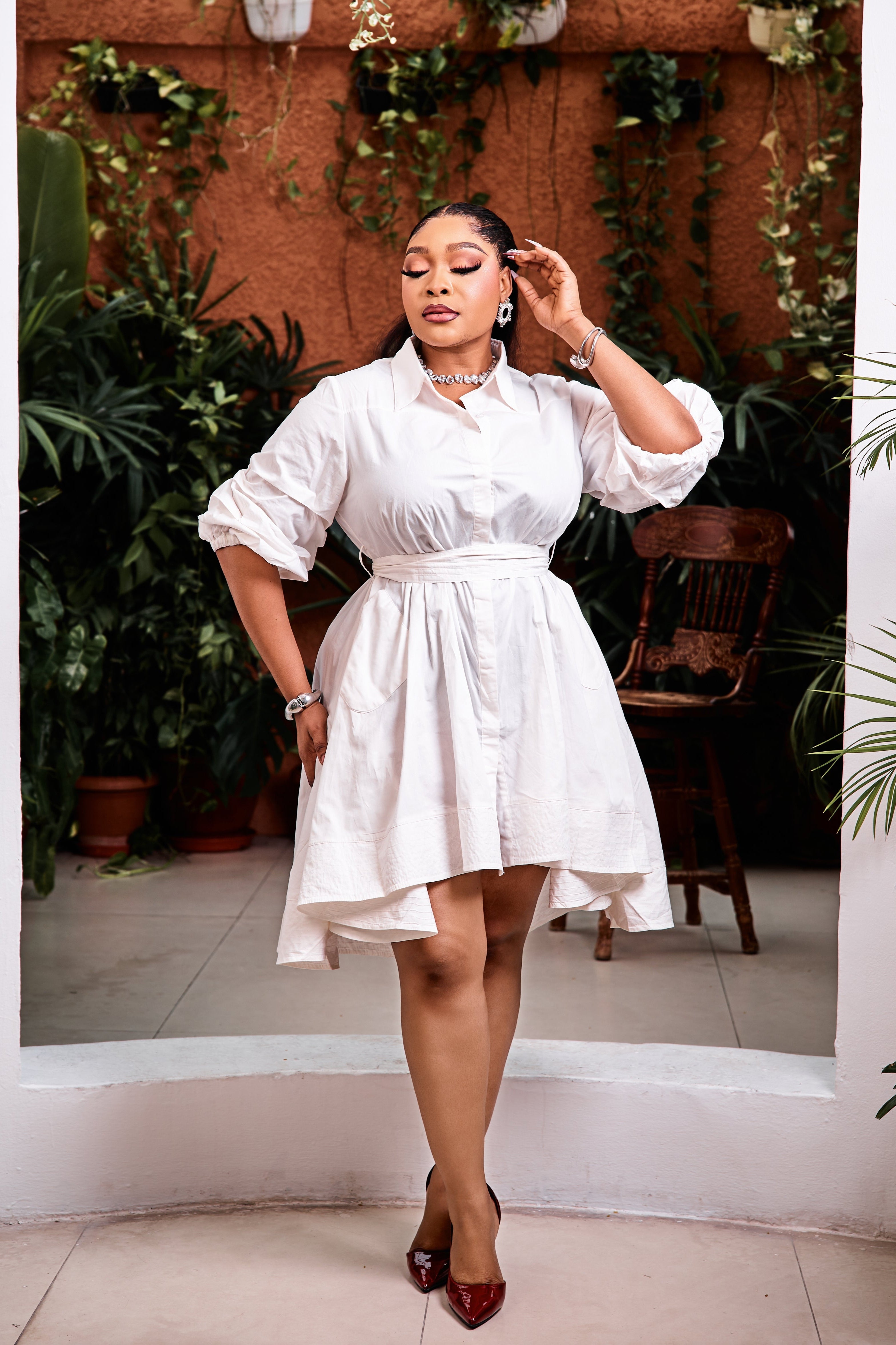 Sterra Fashion Capri Bella high-low dress with flowing fabric and stylish design displayed in this image.