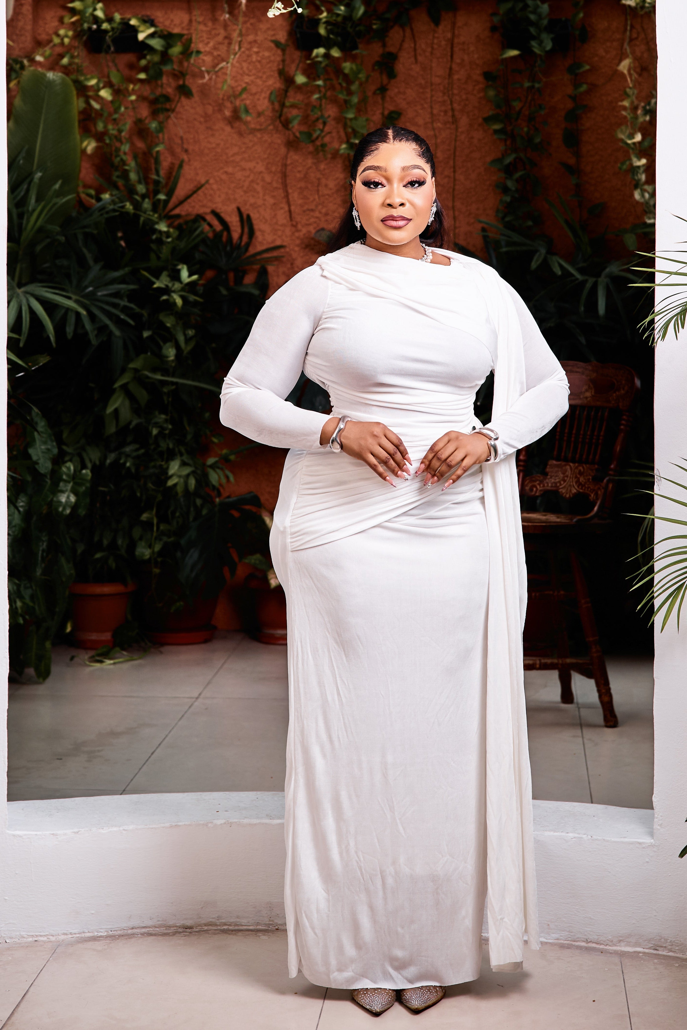 Elegant Opaline Royale Gown by STERA FASHION, featuring flowing fabric and intricate detailing in a refined design.