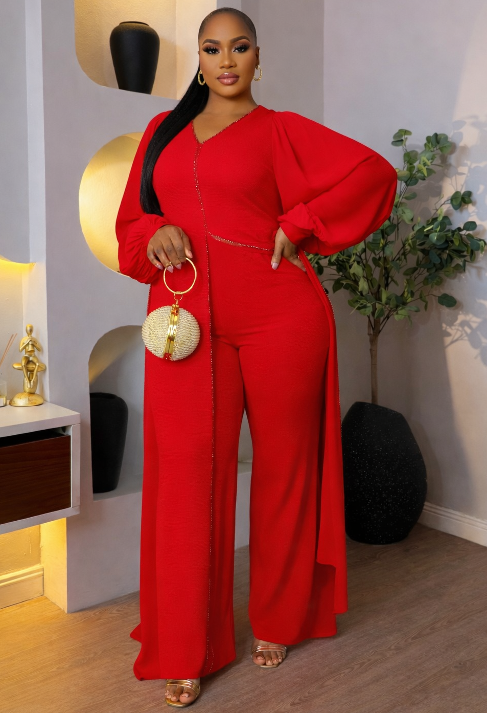 Crimson embellished jumpsuit by STERA FASHION BOUTIQUE featuring intricate beadwork and stylish fit, perfect for elegant occasions.