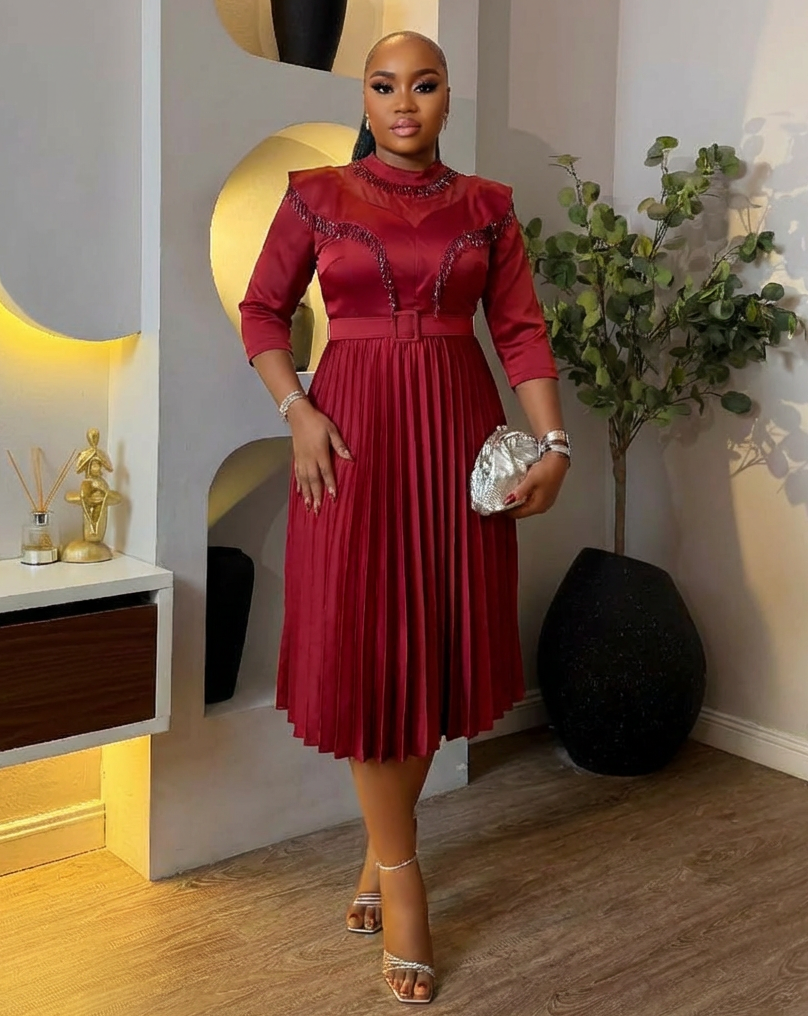 Elegant Bloom & Pleats Queen Dress by STERA FASHION BOUTIQUE featuring floral patterns and a flowing pleated design.