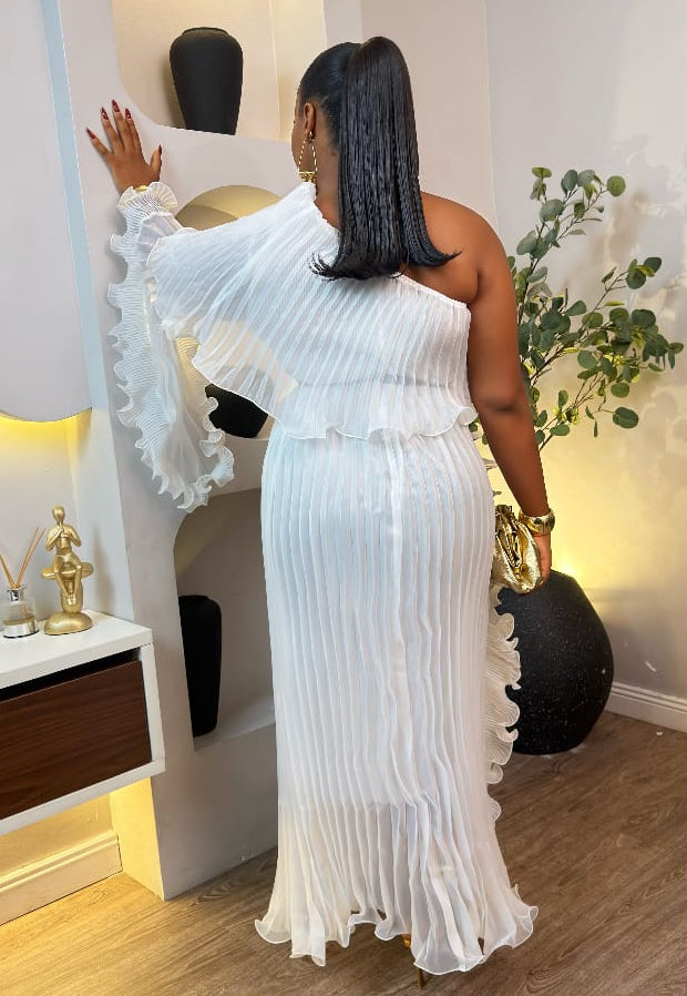 Steria Fashion Ismeria Pleated Gown displayed on a hanger, featuring flowing fabric and elegant pleats for formal occasions.