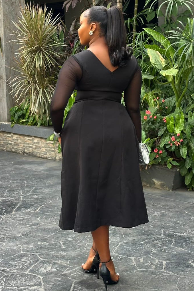 Sterra Fashion Reverie Dress displayed hanging on a mannequin, featuring a flowy fabric and elegant design for stylish occasions.