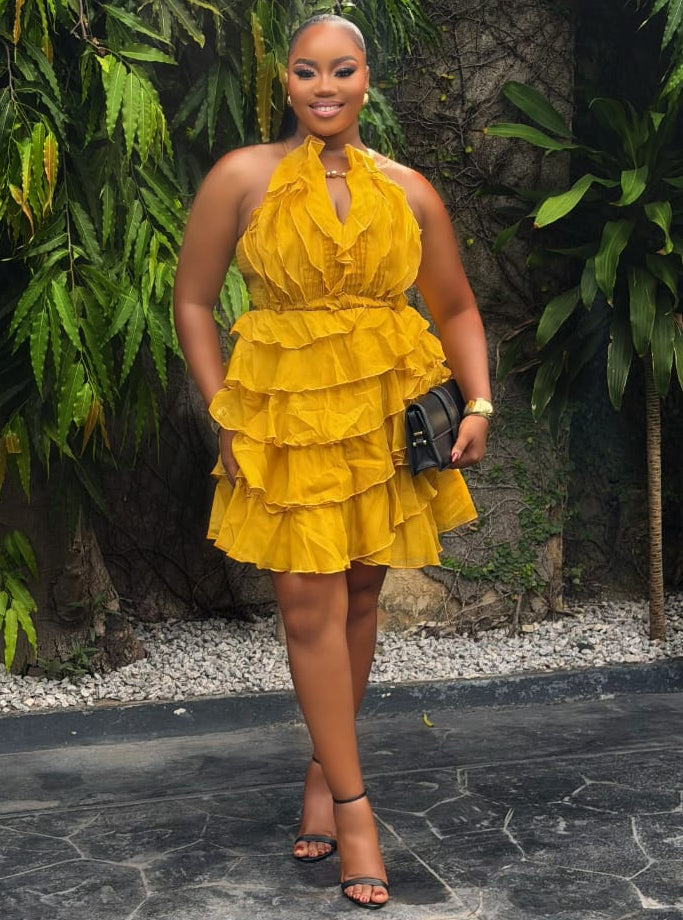 Amber Ruelle Dress by STERA FASHION featuring a flowing, elegant design in warm amber tones, perfect for stylish occasions.