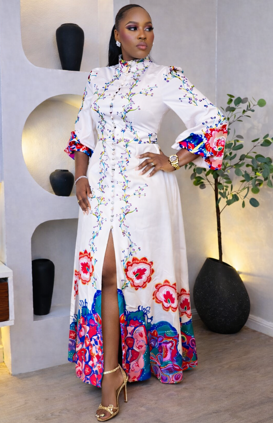 Colorful Petal Tapestry Maxi dress by STERA FASHION BOUTIQUE displayed on a hanger with floral patterns.