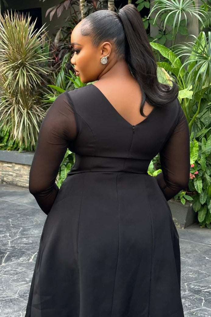 Sterra Fashion Reverie Dress displayed on a mannequin, featuring a flowing, elegant design with floral patterns and a V-neckline.