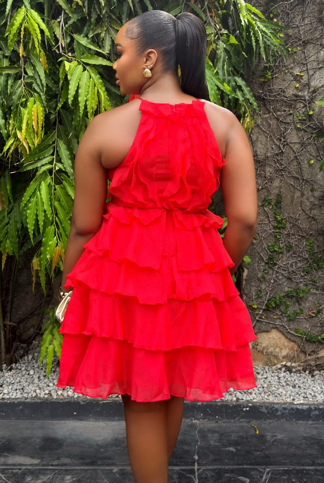 Sterra Fashion Rouge Ruelle dress in vibrant red with elegant design, showcased on a model in a stylish setting.