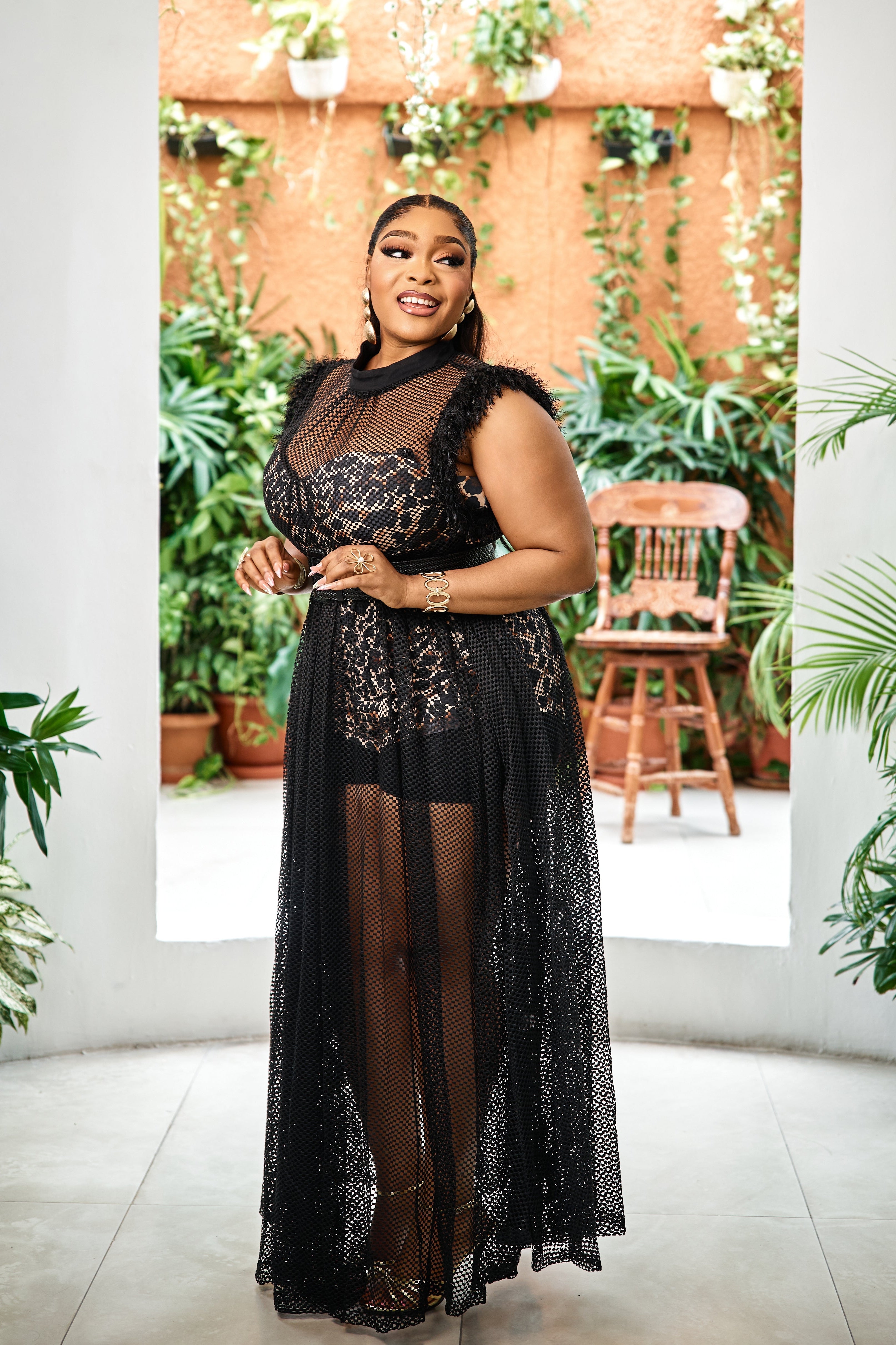 Elegant black Noir Éternelle Couture gown by STERA FASHION displayed on a hanger against a neutral background.