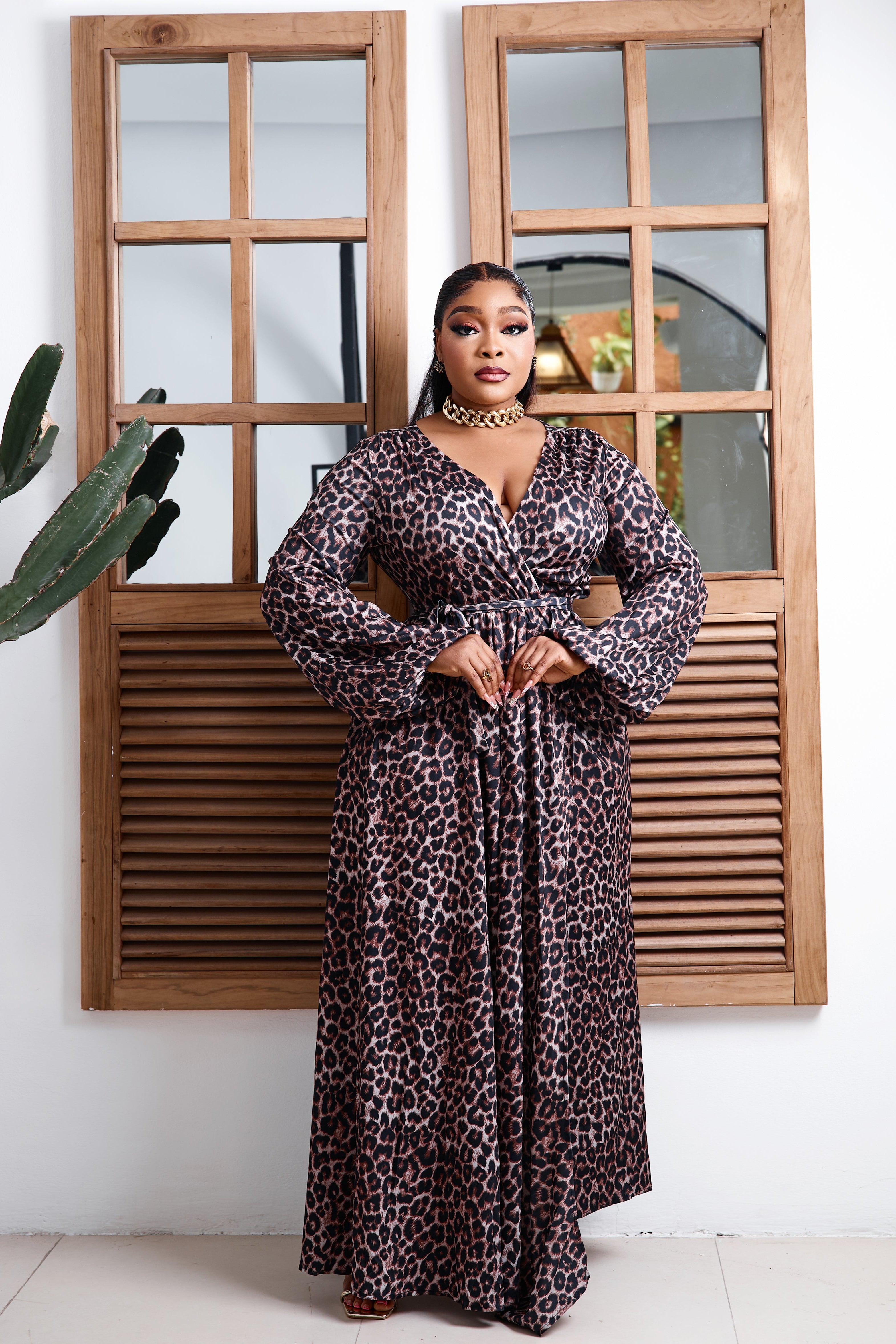 Elegant Savannah Royale Maxi Dress by STERA FASHION displayed on a hanger, featuring flowing fabric and stylish design.
