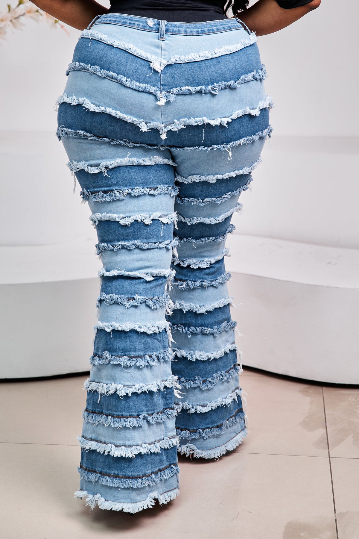 Sterra Fashion Milan Fringe Denim Jeans featuring distressed denim and fringe details, casual streetwear style.