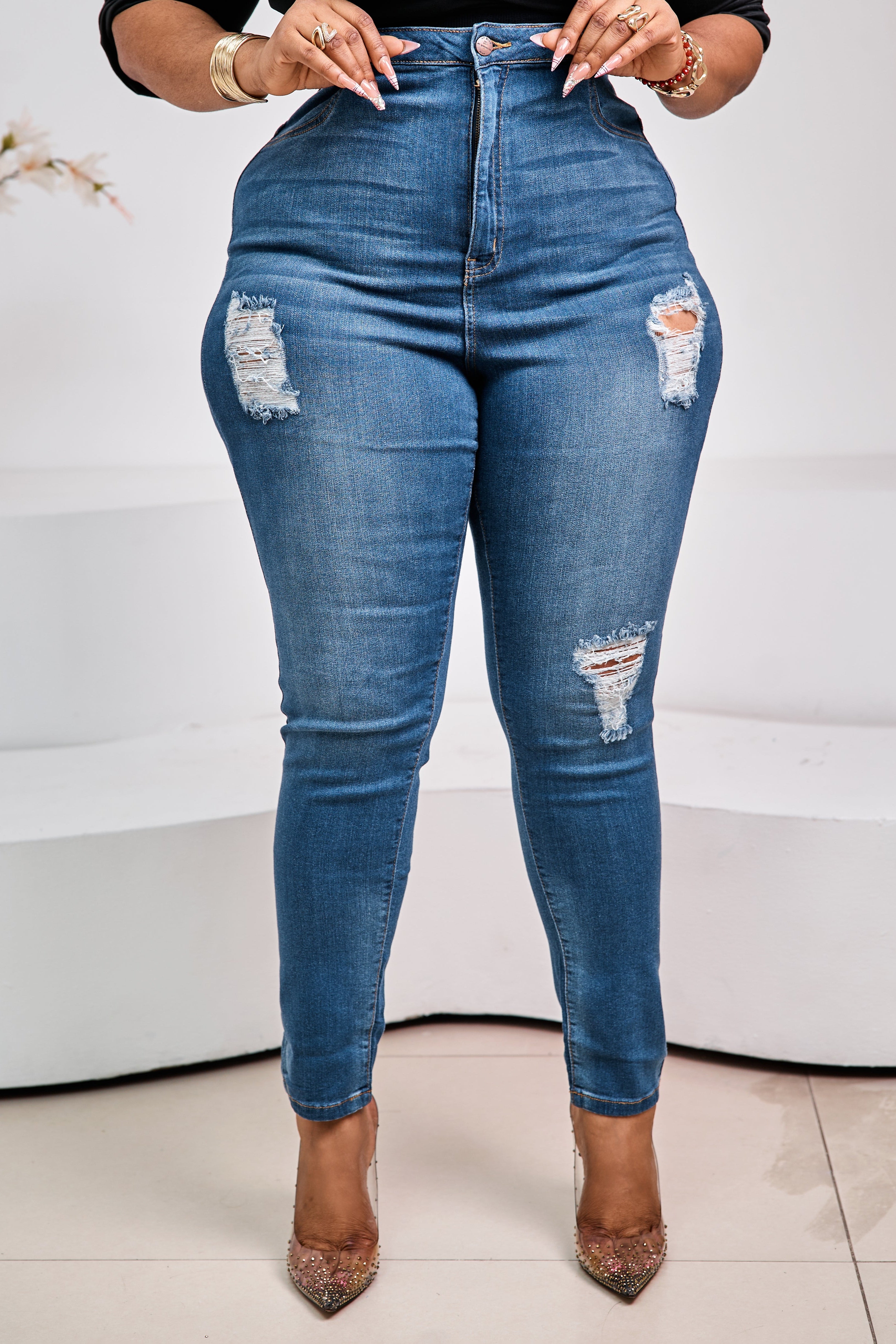 Sterra Fashion Monarch Denim Luxe Jeans displayed on a hanger, showcasing the stylish high-waisted design and dark wash denim fabric.