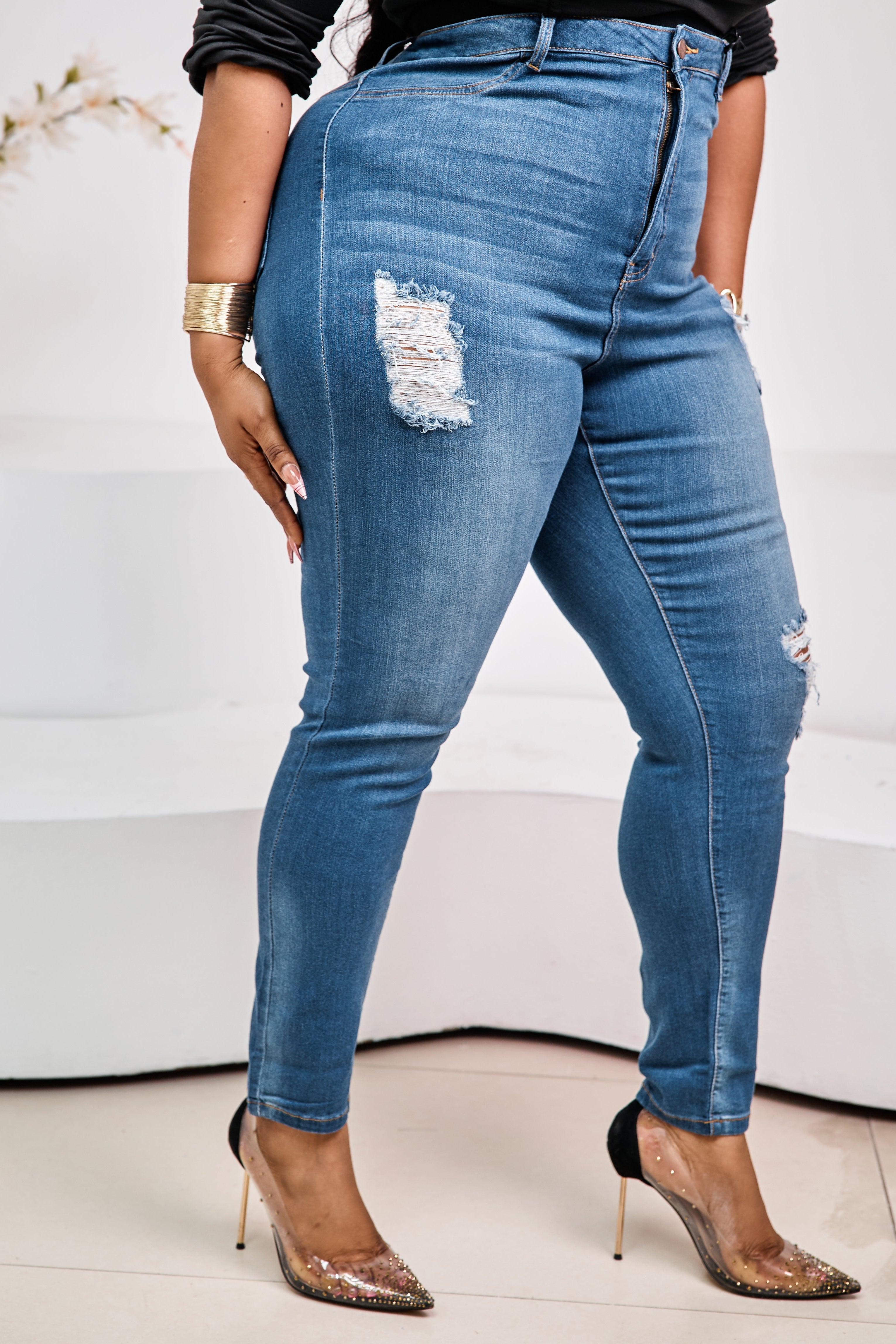 Sterra Fashion Monarch Denim Luxe Jeans displayed on a hanger, showcasing classic five-pocket design and dark blue denim fabric.