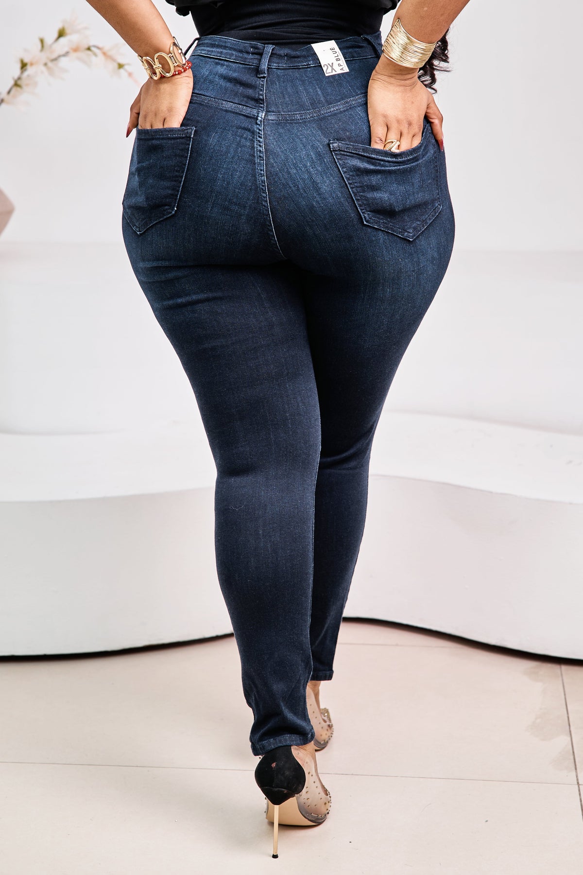 STERA FASHION Éclipse Sculpt Denim jeans shown on a model, featuring a fitted silhouette and classic blue denim fabric.