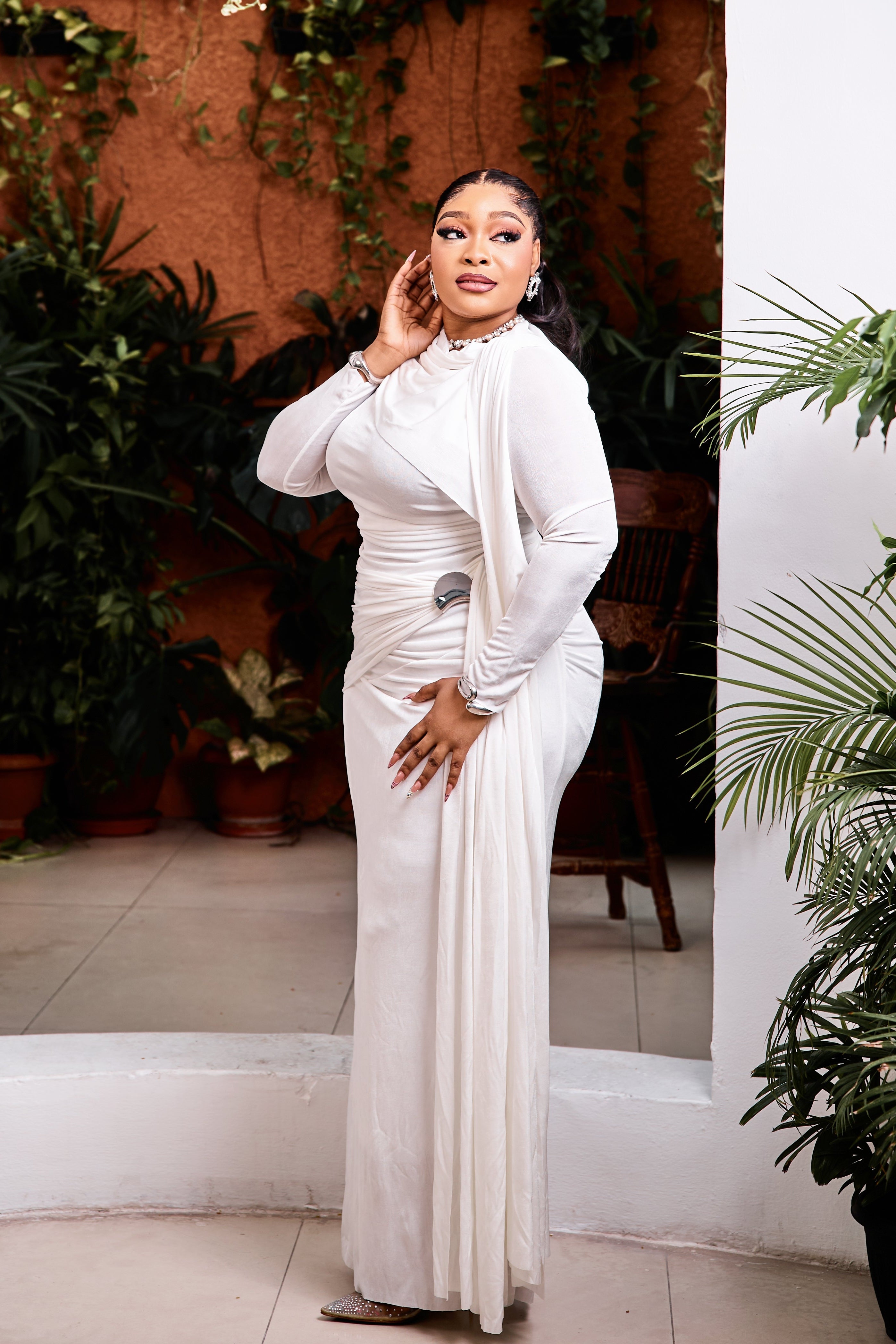 Elegant Opaline Royale Gown by STERA FASHION featuring flowing fabric and intricate design details.