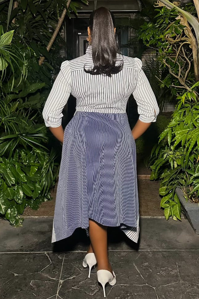 Black and white Monochrome Sovereign Dress by STERA FASHION displayed on a mannequin, showcasing elegant, minimalist design.