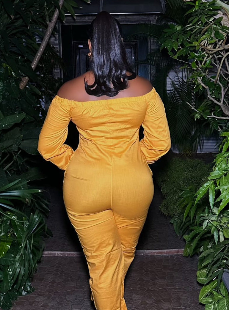 Saffron Aura jumpsuit by STERA FASHION, featuring a stylish, flowy design with a fitted waist and wide-leg pants.