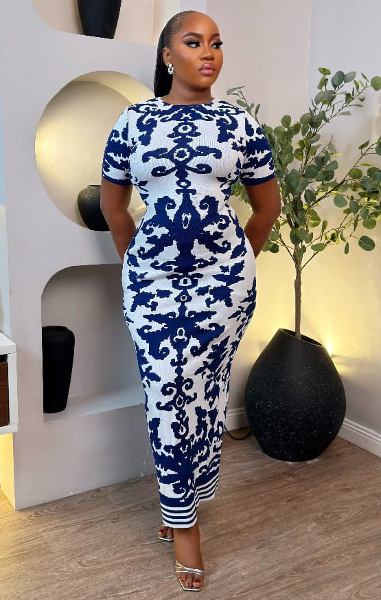 Sterra Fashion Althea Royale Dress displayed on a hanger, showcasing elegant fabric and detailed design in a well-lit setting.