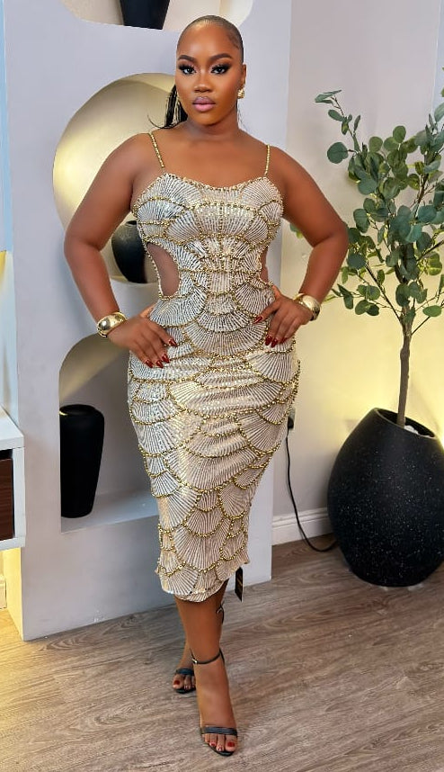 Sterra Fashion Solara Raindance dress featuring flowing fabric and elegant design, shown on a model in a natural outdoor setting.