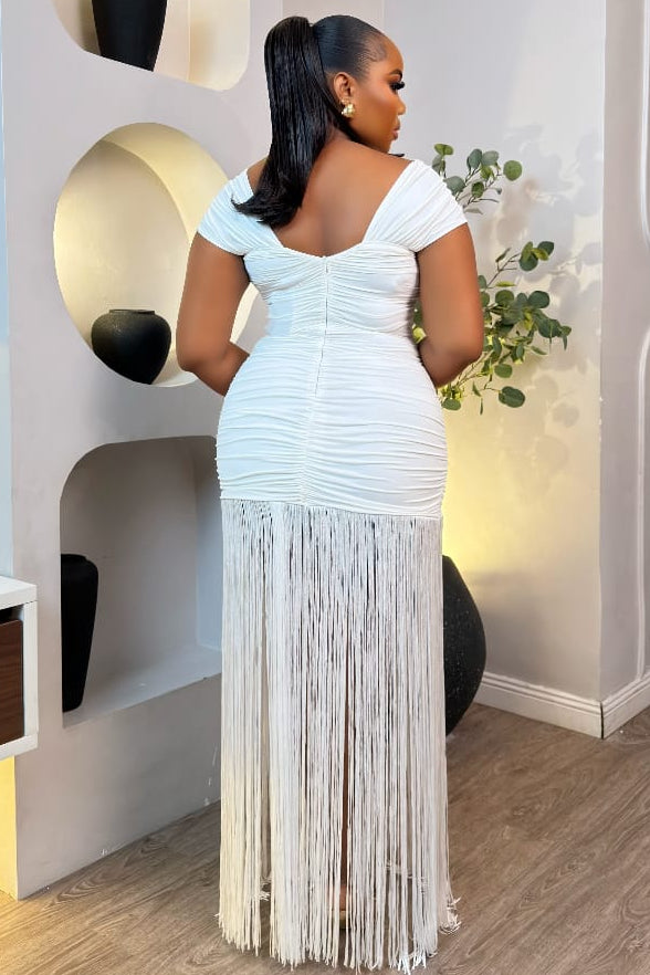 Elegant Riviera Fringe Gown by STERA FASHION featuring flowing fabric and intricate fringe details on a model.