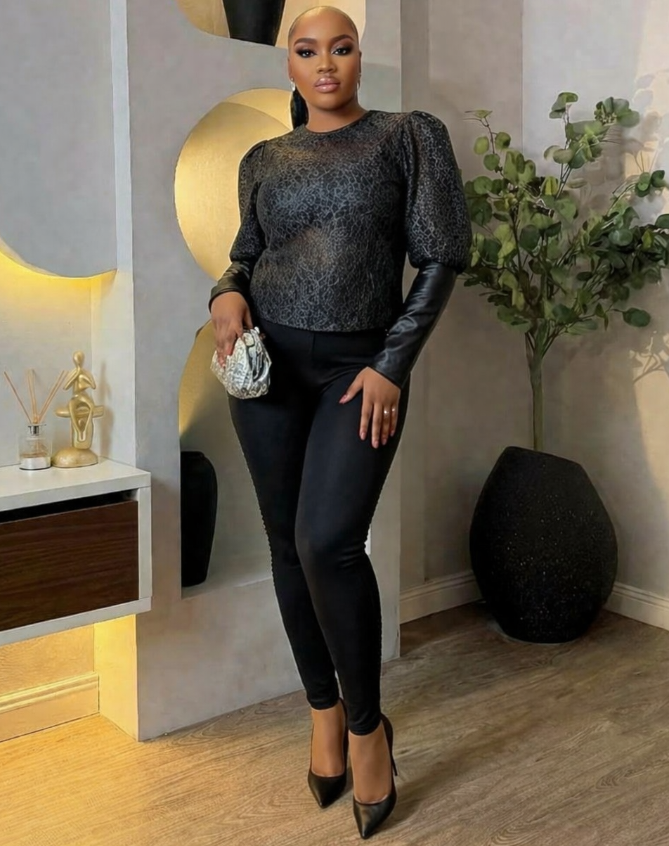 Black lace top from STERA FASHION BOUTIQUE with intricate lace details and a stylish, elegant design.