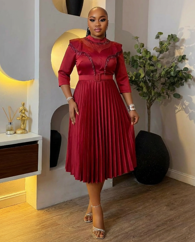 Elegant Bloom & Pleats Queen Dress by STERA FASHION BOUTIQUE featuring floral patterns and flowing pleated fabric.