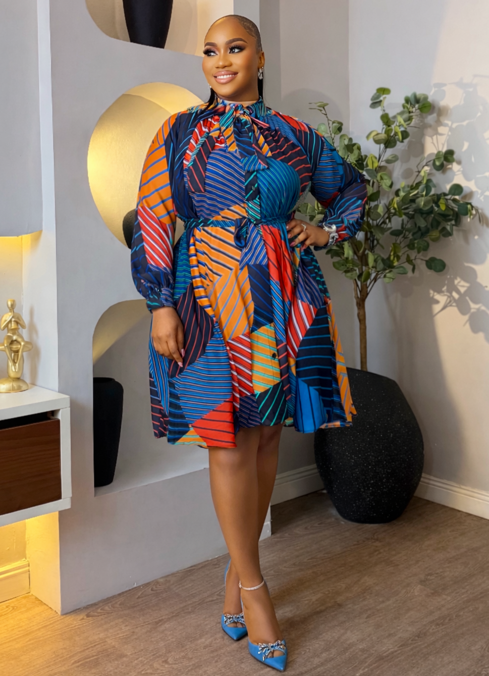 Colorful Mosaic Flow Dress by STERA FASHION BOUTIQUE featuring a flowing, patterned fabric with vibrant mosaic-inspired design.
