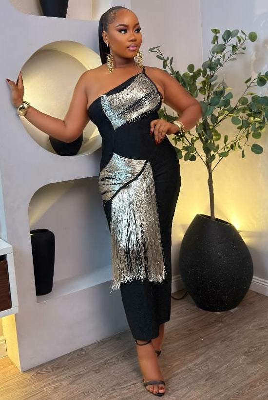 Golden Imperial dress by STERA FASHION displayed on a mannequin, featuring a shimmering gold fabric and elegant design.