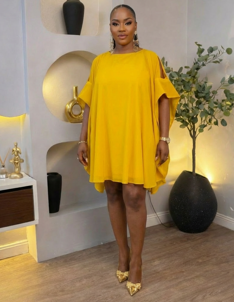 Golden Aura Cape Mini Dress by STERA FASHION BOUTIQUE featuring a stylish gold-toned cape overlay and fitted mini silhouette.