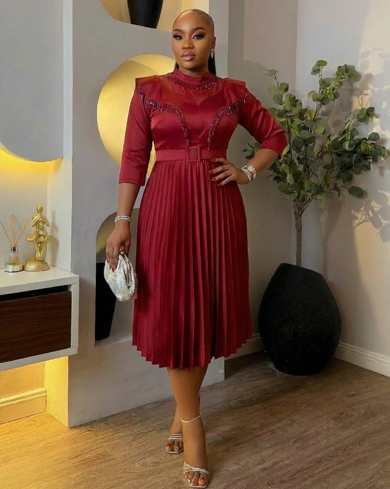 Bloom & Pleats Queen Dress by STERA FASHION BOUTIQUE featuring a flowy, pleated design in vibrant fabric.