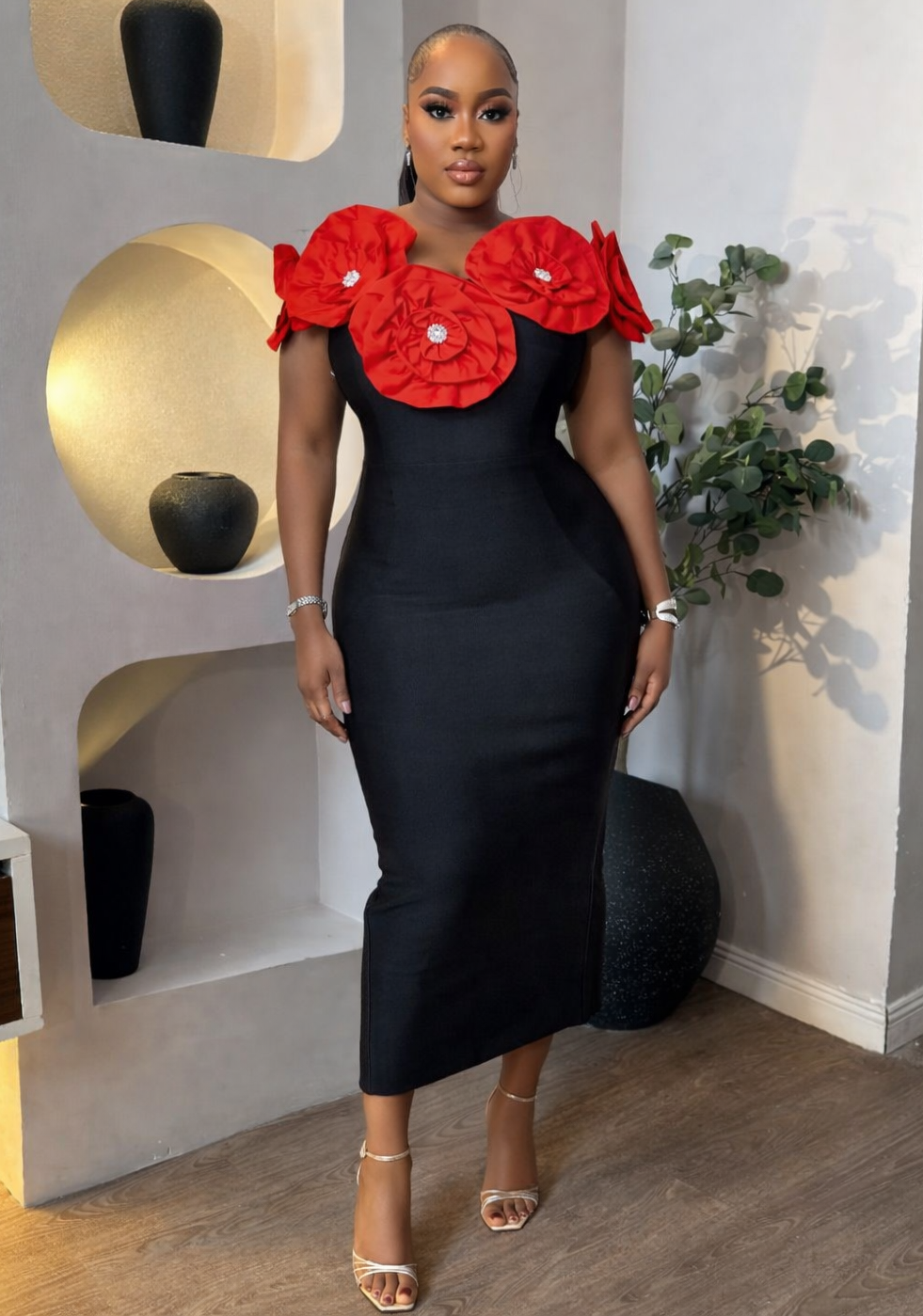 Red Floret Royale Dress by STERA FASHION BOUTIQUE, featuring elegant floral design and flowing fabric on a model.